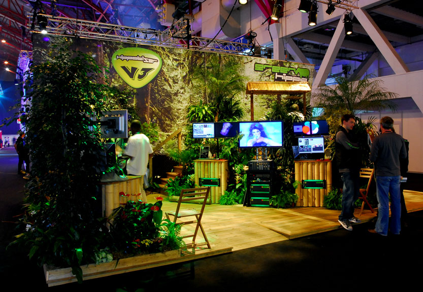 An indoor exhibition setup and exhibition stand incorporating plants and Televisions